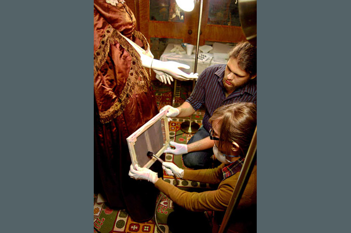 We are training interns to help clean dirt from on artifacts.