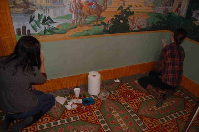 The walls and hand-printed wallpaper, likewise covered with a layer of dirt from the tornado, need cleaning.